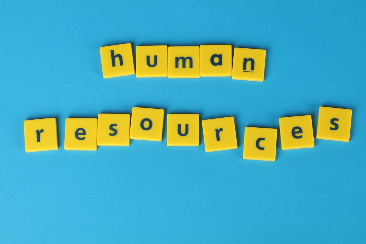 services-01 Yellow tiles spelling 'human resources' on a blue background, ideal for HR or business concepts.